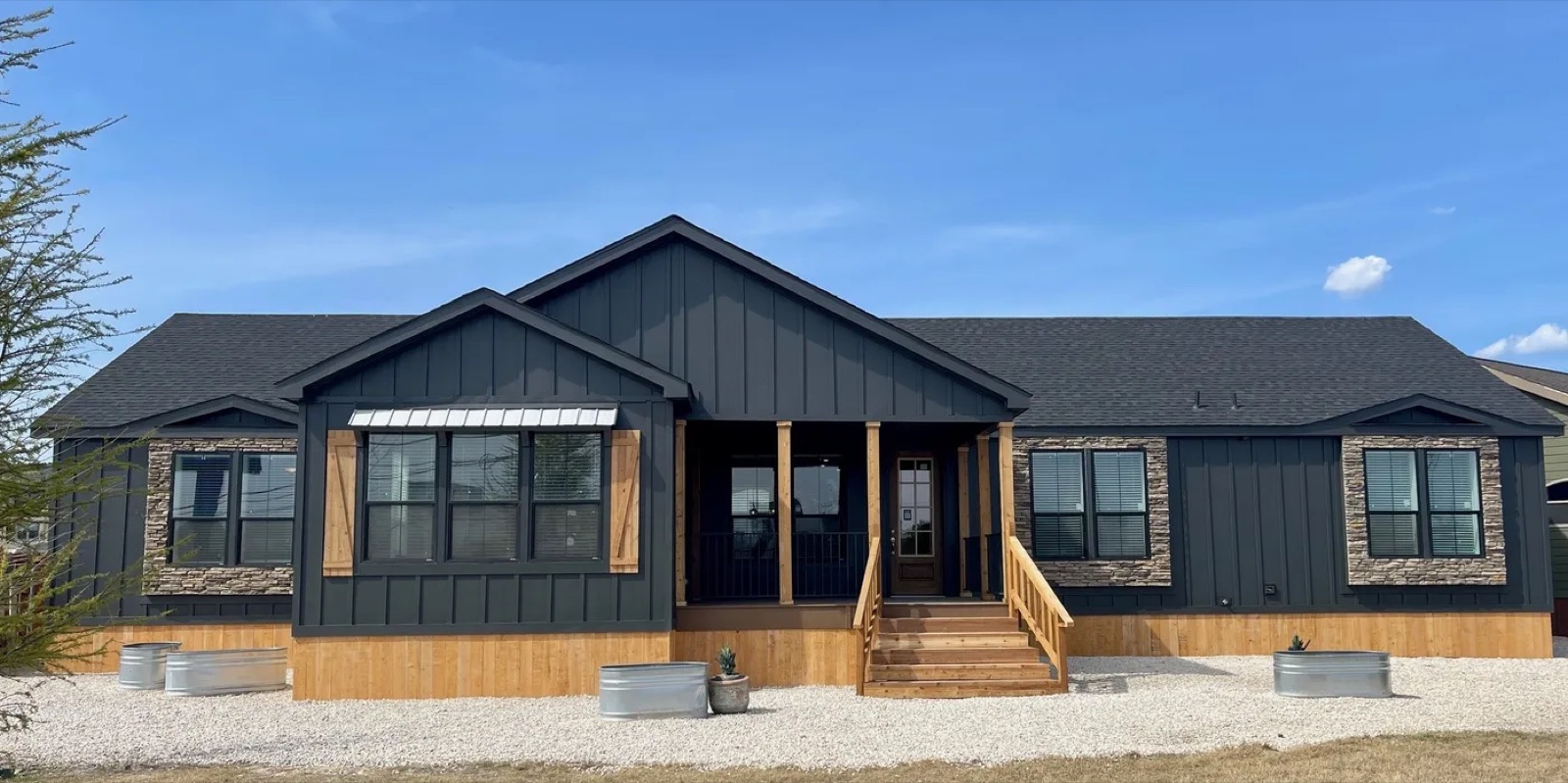 A completed factory-built home representing the outcome of a coordinated residential development